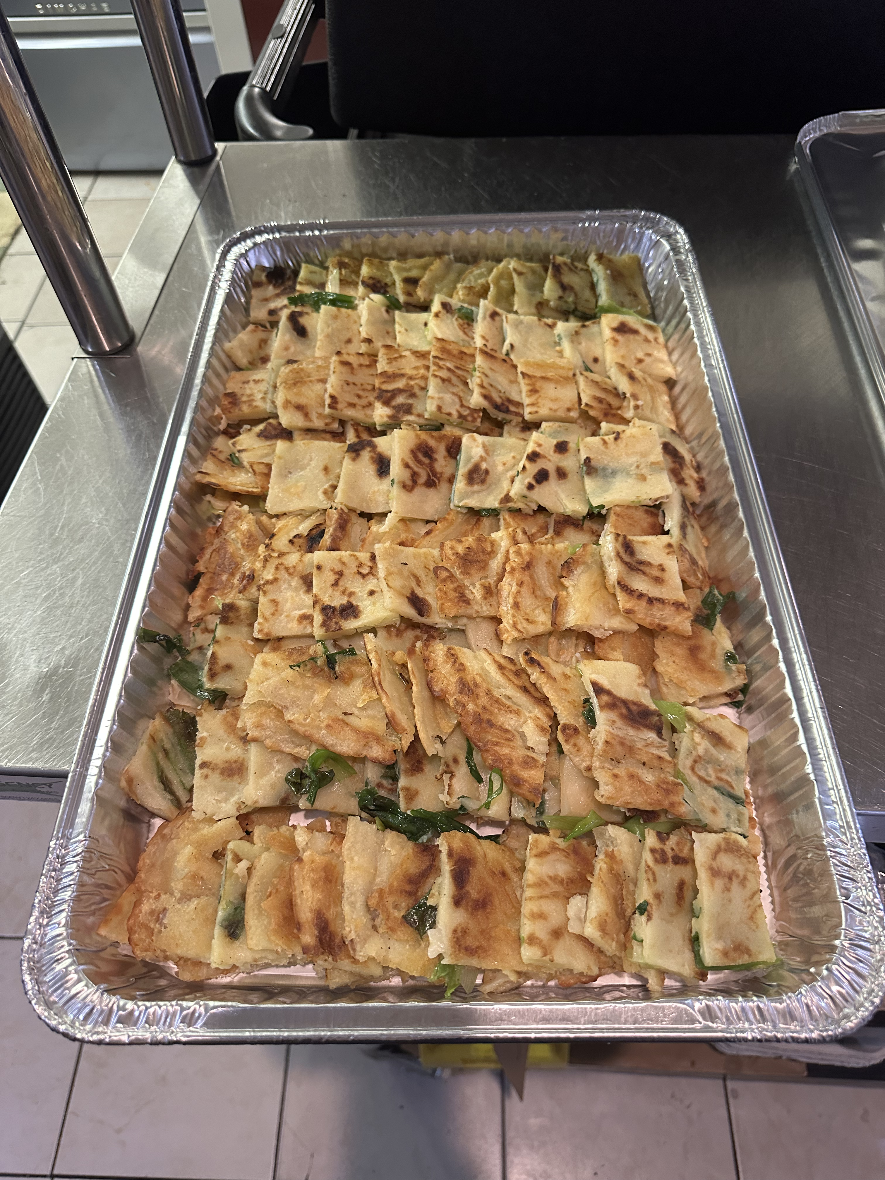 A catering tray of pajeon, Korean savory pancake, from Cana Korean Restaurant