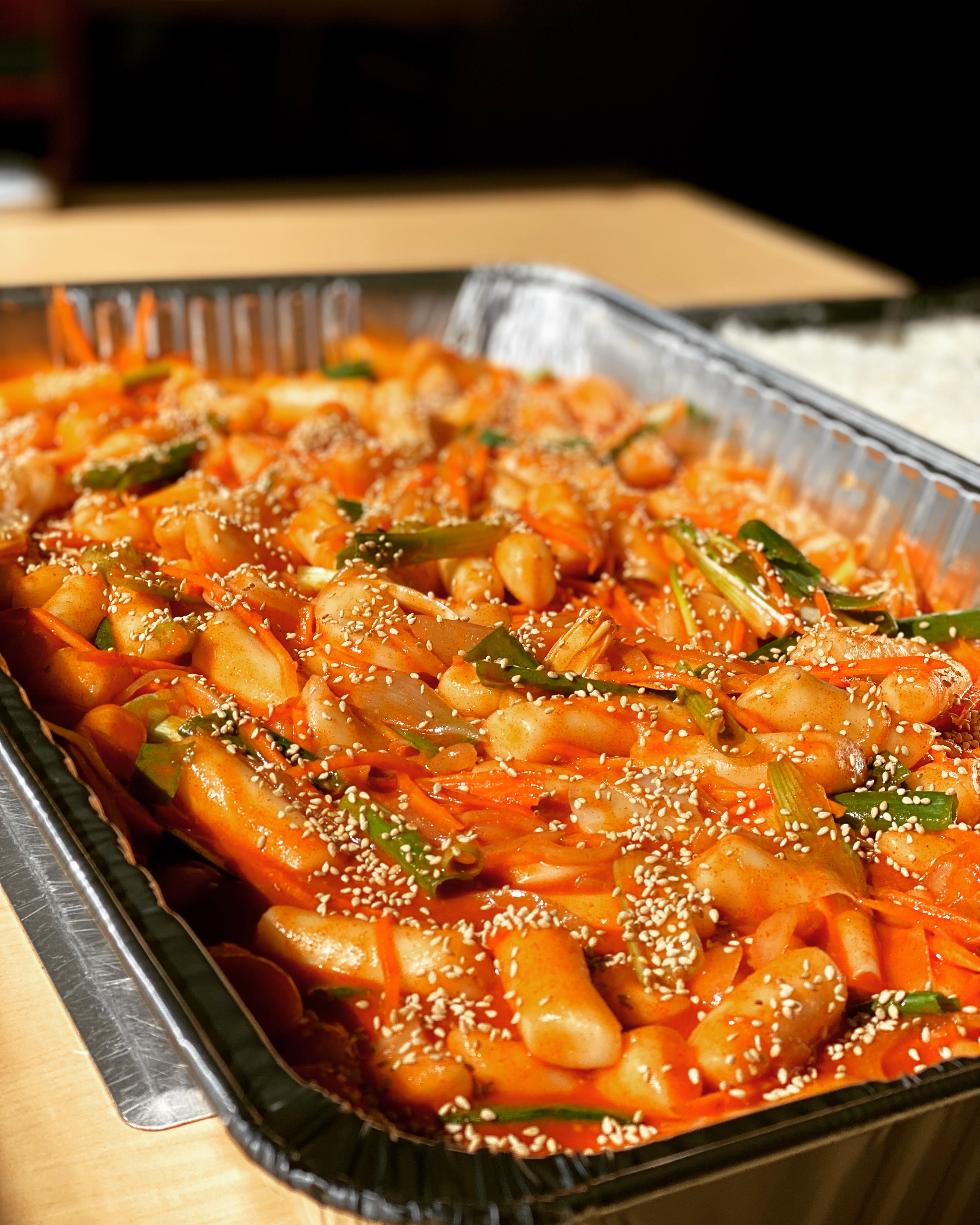 A catering tray of tteok-bokki, Korean rice cakes, from Cana Korean Restaurant