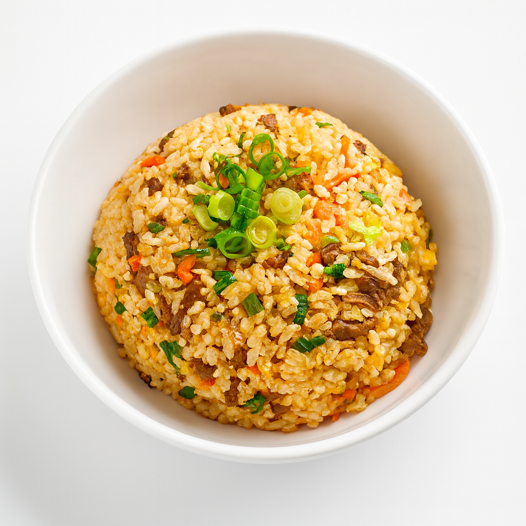 A beautiful bowl of fried rice mixed with veggies and topped with green onions at Cana Korean Restaurant